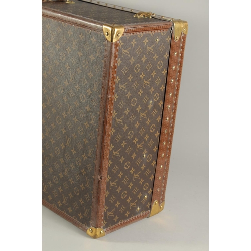 1498 - A LARGE LOUIS VUITTON SUITCASE. No. 1068754. With Louis Vuitton label. Lock no. 1262082. 31.5ins lon... 