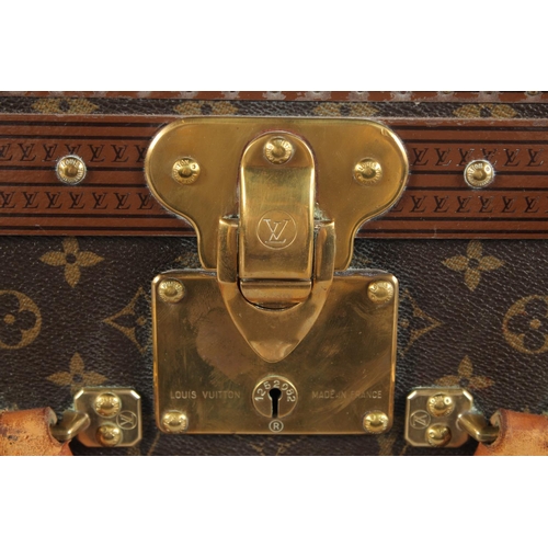 1498 - A LARGE LOUIS VUITTON SUITCASE. No. 1068754. With Louis Vuitton label. Lock no. 1262082. 31.5ins lon... 