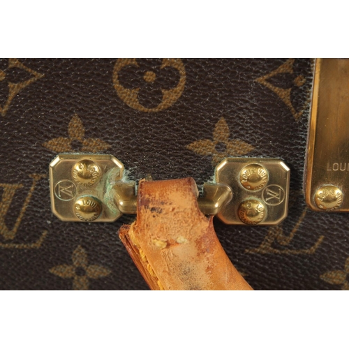 1498 - A LARGE LOUIS VUITTON SUITCASE. No. 1068754. With Louis Vuitton label. Lock no. 1262082. 31.5ins lon... 