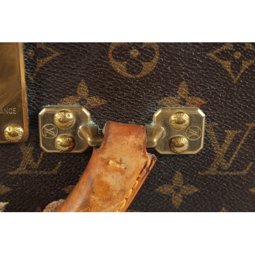 1498 - A LARGE LOUIS VUITTON SUITCASE. No. 1068754. With Louis Vuitton label. Lock no. 1262082. 31.5ins lon... 