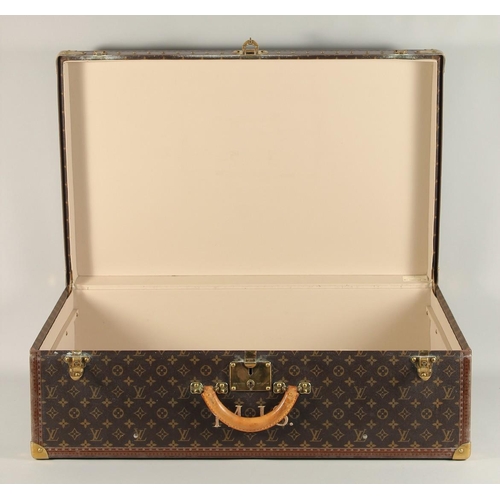 1498 - A LARGE LOUIS VUITTON SUITCASE. No. 1068754. With Louis Vuitton label. Lock no. 1262082. 31.5ins lon... 