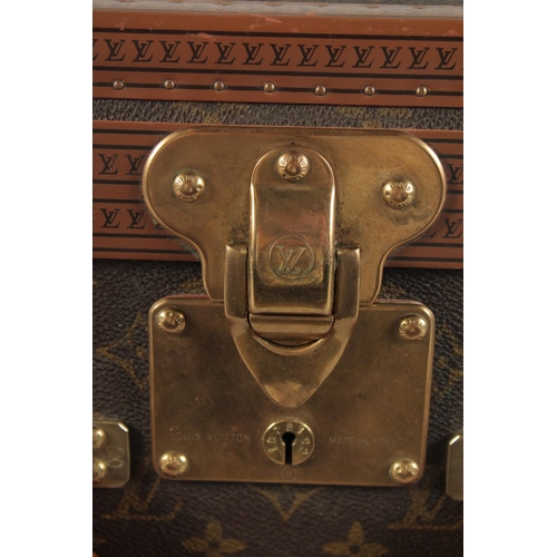 1499 - A LARGE LOUIS VUITTON SUITCASE. No. 081502. With Louis Vuitton label. Lock no. 1078192 with key. 31.... 