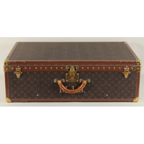 1500 - A LARGE LOUIS VUITTON SUITCASE. No. 1023430. With Louis Vuitton label. Lock no. 1252082. 31.5ins lon... 