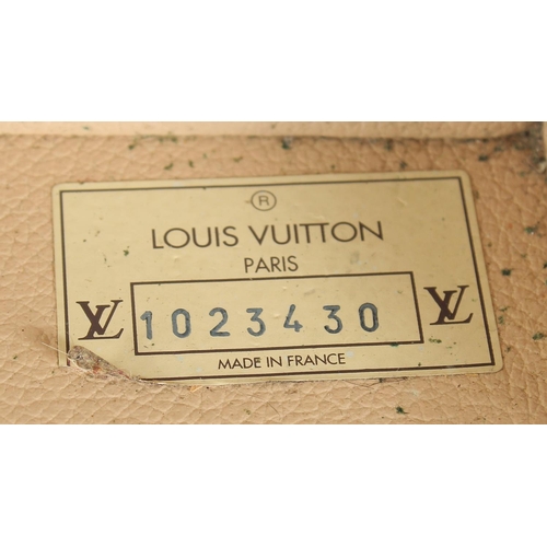 1500 - A LARGE LOUIS VUITTON SUITCASE. No. 1023430. With Louis Vuitton label. Lock no. 1252082. 31.5ins lon... 