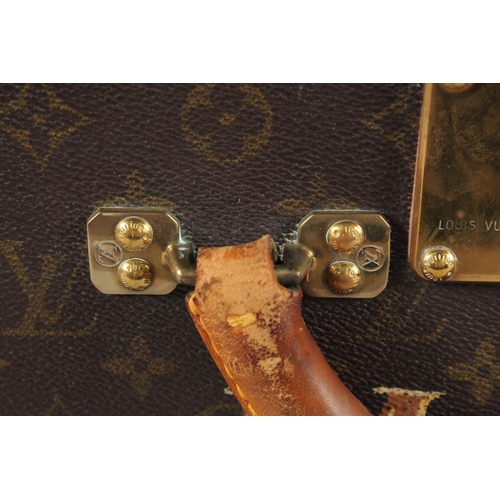 1500 - A LARGE LOUIS VUITTON SUITCASE. No. 1023430. With Louis Vuitton label. Lock no. 1252082. 31.5ins lon... 