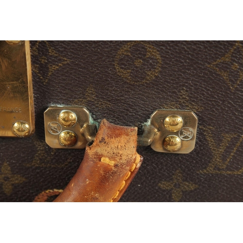 1500 - A LARGE LOUIS VUITTON SUITCASE. No. 1023430. With Louis Vuitton label. Lock no. 1252082. 31.5ins lon... 