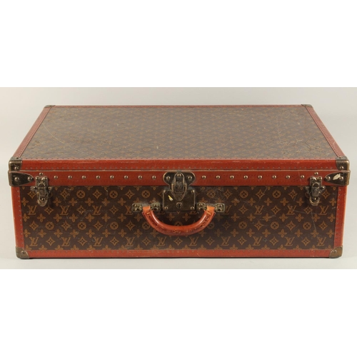 1501 - A LARGE LOUIS VUITTON SUITCASE. No. 847181. With Louis Vuitton label. Lock no. 105394. 31.5ins long ... 