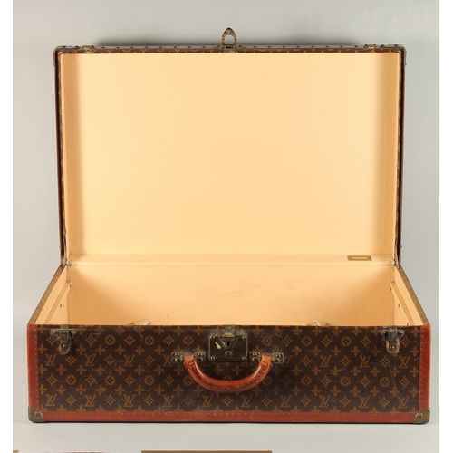 1501 - A LARGE LOUIS VUITTON SUITCASE. No. 847181. With Louis Vuitton label. Lock no. 105394. 31.5ins long ... 