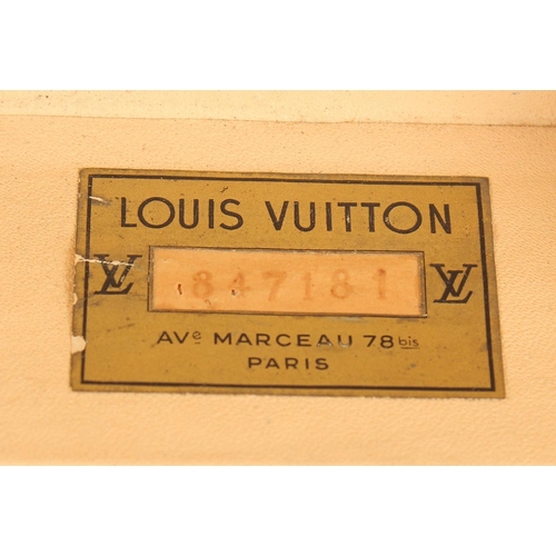 1501 - A LARGE LOUIS VUITTON SUITCASE. No. 847181. With Louis Vuitton label. Lock no. 105394. 31.5ins long ... 