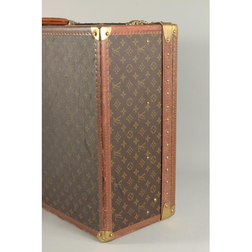 1502 - A LARGE LOUIS VUITTON SUITCASE. No. 981622. Label faded. Lock no. 1078192. 31.5ins long x 20.5ins wi... 