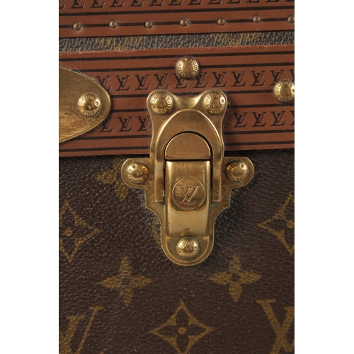 1502 - A LARGE LOUIS VUITTON SUITCASE. No. 981622. Label faded. Lock no. 1078192. 31.5ins long x 20.5ins wi... 