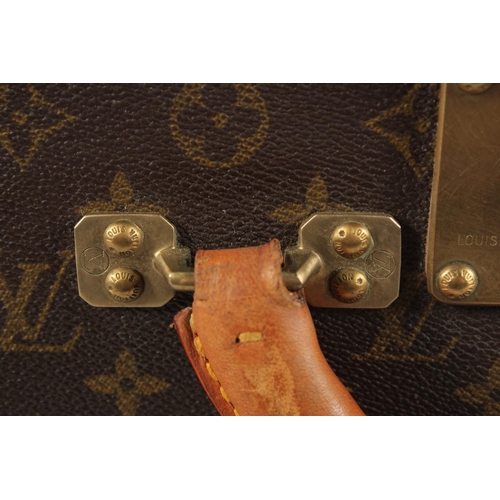 1502 - A LARGE LOUIS VUITTON SUITCASE. No. 981622. Label faded. Lock no. 1078192. 31.5ins long x 20.5ins wi... 