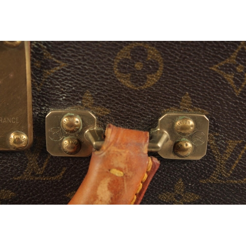 1502 - A LARGE LOUIS VUITTON SUITCASE. No. 981622. Label faded. Lock no. 1078192. 31.5ins long x 20.5ins wi... 