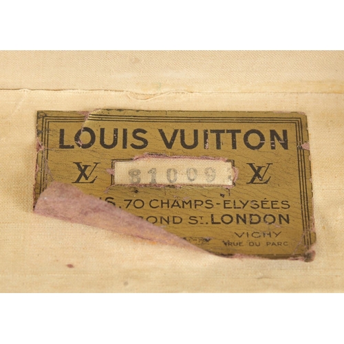 1504 - A LOUIS VUITTON SUITCASE. No. 810009 with Louis Vuitton label and ARTHUR GILBERT, New York. Lock no.... 