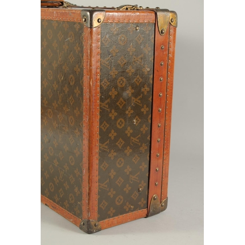 1504 - A LOUIS VUITTON SUITCASE. No. 810009 with Louis Vuitton label and ARTHUR GILBERT, New York. Lock no.... 