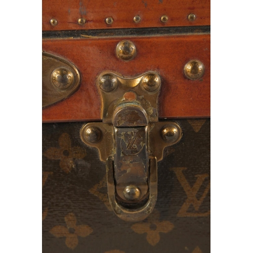 1504 - A LOUIS VUITTON SUITCASE. No. 810009 with Louis Vuitton label and ARTHUR GILBERT, New York. Lock no.... 