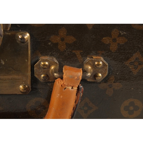 1504 - A LOUIS VUITTON SUITCASE. No. 810009 with Louis Vuitton label and ARTHUR GILBERT, New York. Lock no.... 