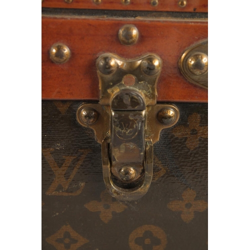 1504 - A LOUIS VUITTON SUITCASE. No. 810009 with Louis Vuitton label and ARTHUR GILBERT, New York. Lock no.... 