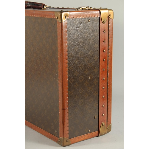 1505 - A LOUIS VUITTON SUITCASE. No. 82154 with Louis Vuitton label. Saks & Co., New York label. Pull-out t... 