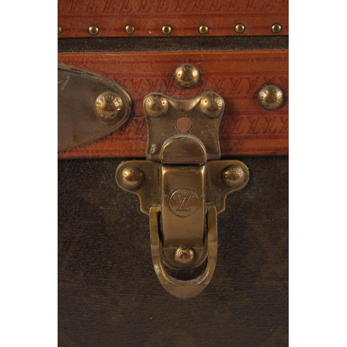 1505 - A LOUIS VUITTON SUITCASE. No. 82154 with Louis Vuitton label. Saks & Co., New York label. Pull-out t... 