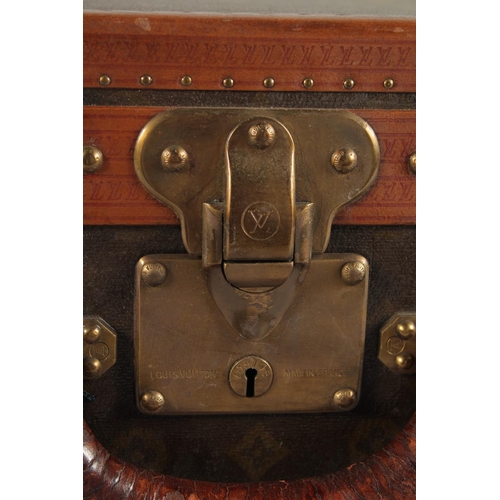 1505 - A LOUIS VUITTON SUITCASE. No. 82154 with Louis Vuitton label. Saks & Co., New York label. Pull-out t... 