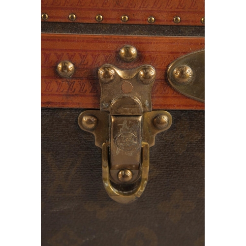 1505 - A LOUIS VUITTON SUITCASE. No. 82154 with Louis Vuitton label. Saks & Co., New York label. Pull-out t... 