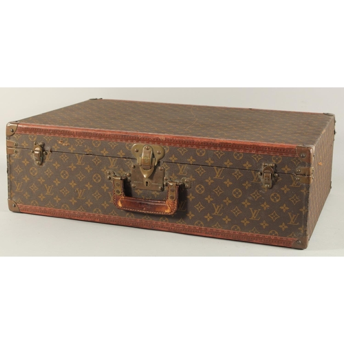 1506 - A LOUIS VUITTON SUITCASE. Louis Vuitton label missing. Lock no. H9. 27.5ins long x 18.5ins wide x 8.... 