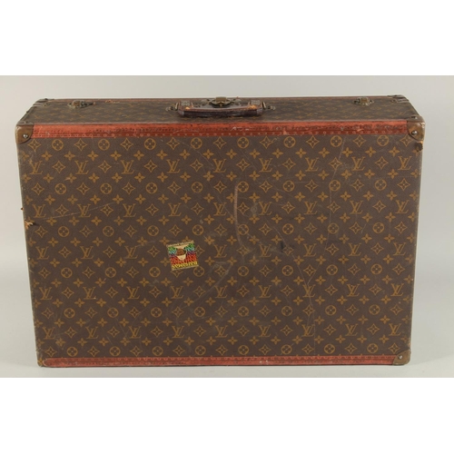 1506 - A LOUIS VUITTON SUITCASE. Louis Vuitton label missing. Lock no. H9. 27.5ins long x 18.5ins wide x 8.... 