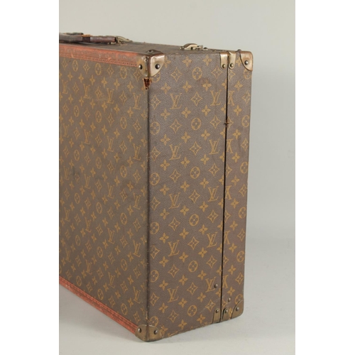 1506 - A LOUIS VUITTON SUITCASE. Louis Vuitton label missing. Lock no. H9. 27.5ins long x 18.5ins wide x 8.... 