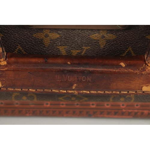 1506 - A LOUIS VUITTON SUITCASE. Louis Vuitton label missing. Lock no. H9. 27.5ins long x 18.5ins wide x 8.... 