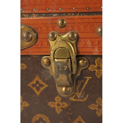 1507 - A LOUIS VUITTON SUITCASE. No. 771989 with Louis Vuitton label. FROM Saks & Co., New York. Lock no. 0... 