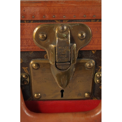 1507 - A LOUIS VUITTON SUITCASE. No. 771989 with Louis Vuitton label. FROM Saks & Co., New York. Lock no. 0... 