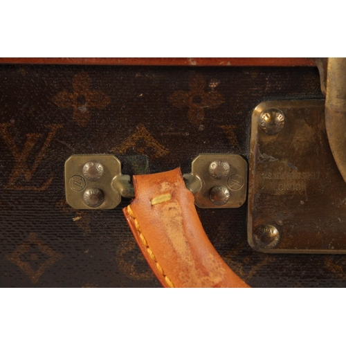 1508 - A LOUIS VUITTON SUITCASE. Label faint, also retail label faint, with lift-out tray. Lock no. 065564.... 