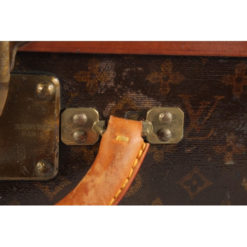 1508 - A LOUIS VUITTON SUITCASE. Label faint, also retail label faint, with lift-out tray. Lock no. 065564.... 