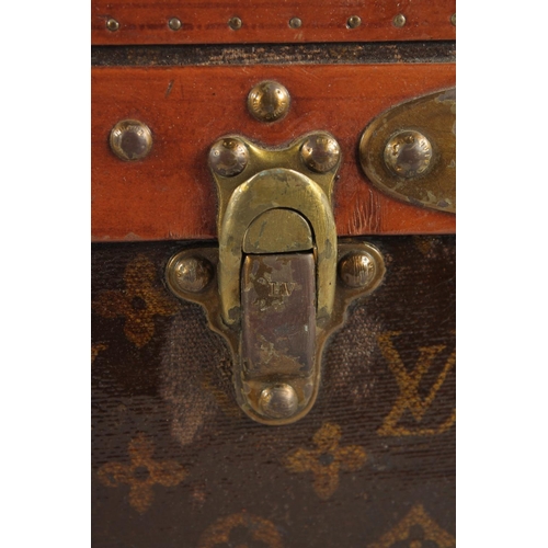 1508 - A LOUIS VUITTON SUITCASE. Label faint, also retail label faint, with lift-out tray. Lock no. 065564.... 