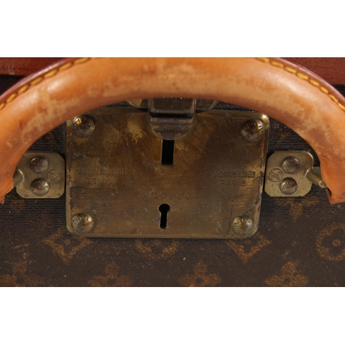 1508 - A LOUIS VUITTON SUITCASE. Label faint, also retail label faint, with lift-out tray. Lock no. 065564.... 