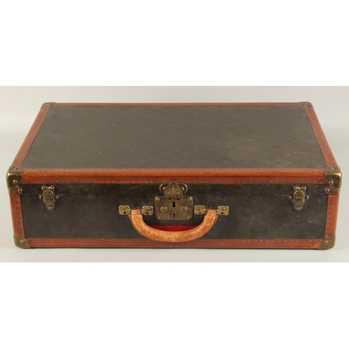 1509 - A LOUIS VUITTON SUITCASE. No. 816144, with Louis Vuitton label. Pull-out tray.  Lock No. 107170. 26i... 