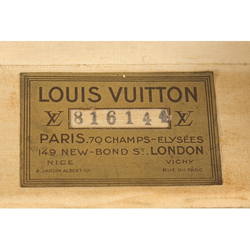 1509 - A LOUIS VUITTON SUITCASE. No. 816144, with Louis Vuitton label. Pull-out tray.  Lock No. 107170. 26i... 