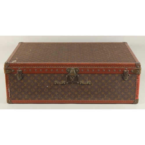 1511 - A LOUIS VUITTON SUITCASE. No. 920890, with Louis Vuitton label. Brass lock no 147171. Handle missing... 