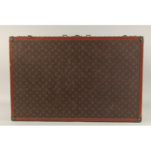 1511 - A LOUIS VUITTON SUITCASE. No. 920890, with Louis Vuitton label. Brass lock no 147171. Handle missing... 