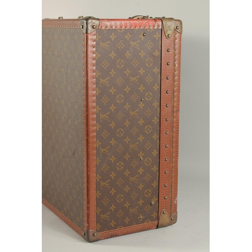 1511 - A LOUIS VUITTON SUITCASE. No. 920890, with Louis Vuitton label. Brass lock no 147171. Handle missing... 