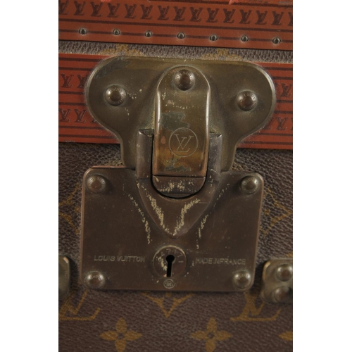 1511 - A LOUIS VUITTON SUITCASE. No. 920890, with Louis Vuitton label. Brass lock no 147171. Handle missing... 