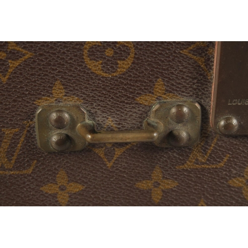 1511 - A LOUIS VUITTON SUITCASE. No. 920890, with Louis Vuitton label. Brass lock no 147171. Handle missing... 