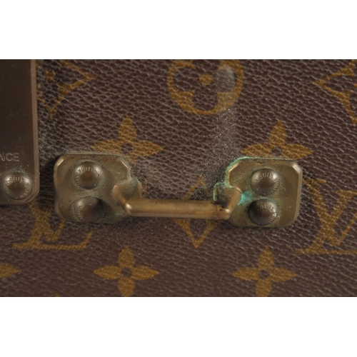 1511 - A LOUIS VUITTON SUITCASE. No. 920890, with Louis Vuitton label. Brass lock no 147171. Handle missing... 