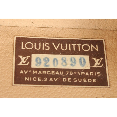 1511 - A LOUIS VUITTON SUITCASE. No. 920890, with Louis Vuitton label. Brass lock no 147171. Handle missing... 