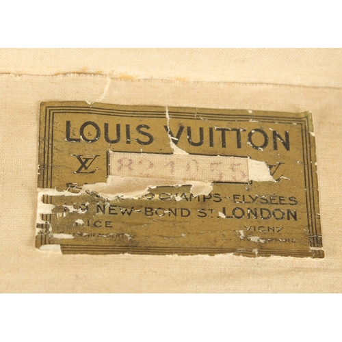 1512 - A LOUIS VUITTON SUITCASE. No. 821055, with Louis Vuitton label. Brass lock no.108381. Handle missing... 