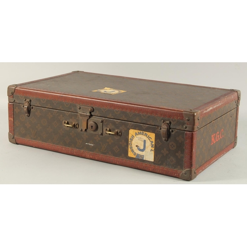 1513 - A LOUIS VUITTON SUITCASE. No. 788153, with Louis Vuitton label. Brass lock 113, with two labels SWED... 