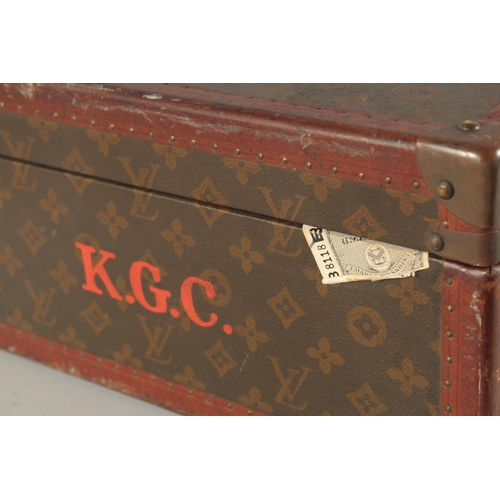 1513 - A LOUIS VUITTON SUITCASE. No. 788153, with Louis Vuitton label. Brass lock 113, with two labels SWED... 