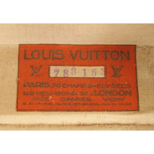 1513 - A LOUIS VUITTON SUITCASE. No. 788153, with Louis Vuitton label. Brass lock 113, with two labels SWED... 