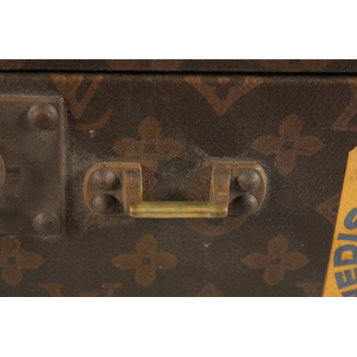 1513 - A LOUIS VUITTON SUITCASE. No. 788153, with Louis Vuitton label. Brass lock 113, with two labels SWED... 